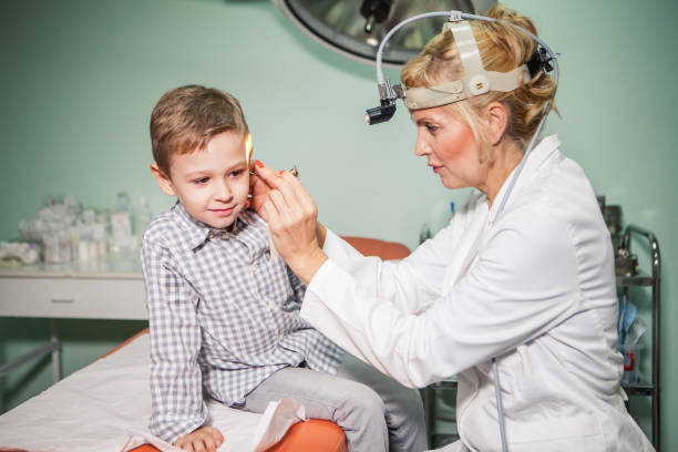 istock Cute boy at otolaryngologist's office 928009300