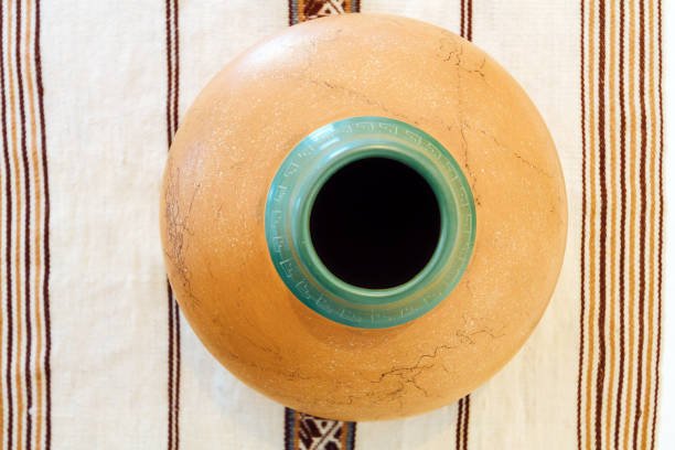 istock Macro close-up of a ceramic vase on fabric with Peruvian design 928016376