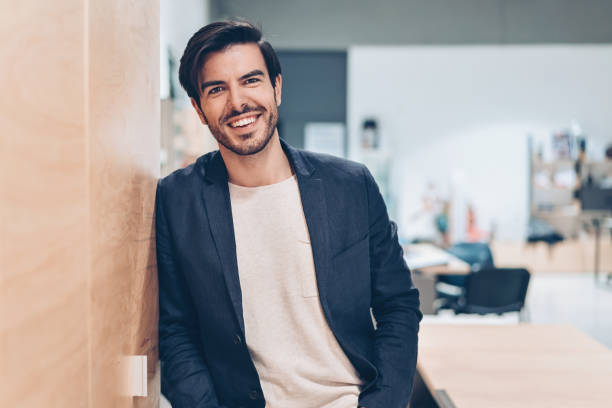 istock Smiling businessman in the office 928016528
