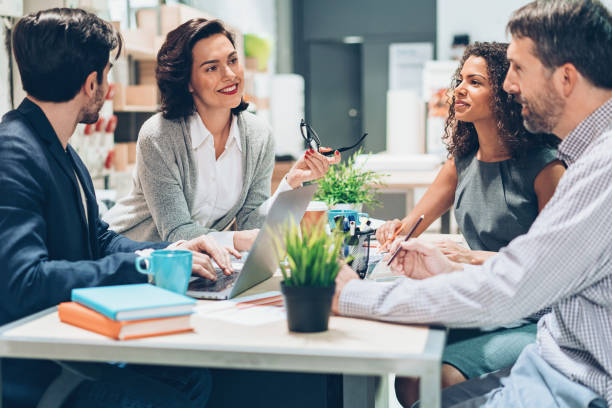 istock Businesswoman in discussion with her team 928016530