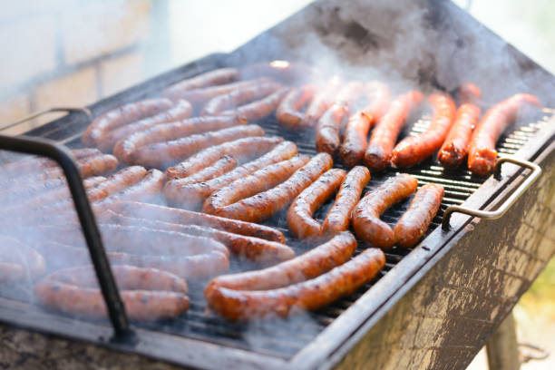 istock Grilling sausages on barbecue grill 928020122