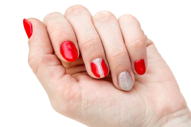 istock Red manicure on female hand. Isolated on white. Close up. 928020180
