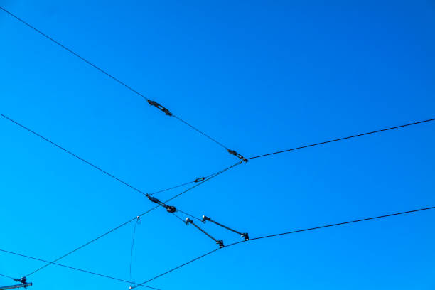 istock Railroad overhead lines against clear blue sky Contact wire 928020516