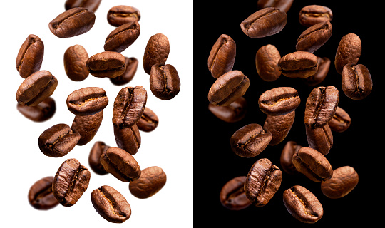 Falling coffee beans isolated on white background with clipping path