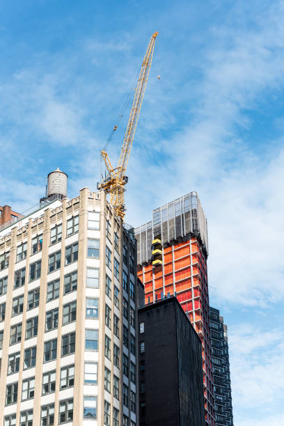istock New York City Christopher Columbus Circle in Midtown Manhattan with skyscrapers, construction, crane, blue sky, windows buildings 928020672