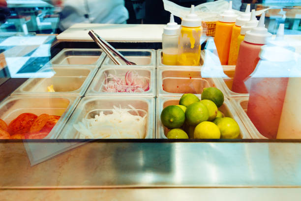 istock Vegetables and sauces on steel counter in a buffet 928020746