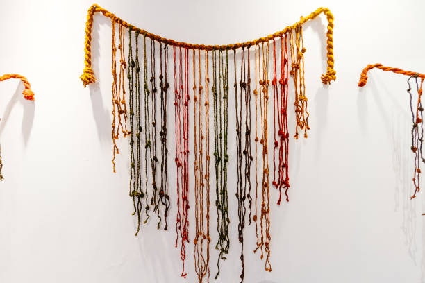 Colorful Quipu (abacus inca) caught on a wall
