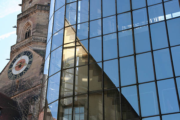 istock modern glass building and old church,what a nice contrast 92802261
