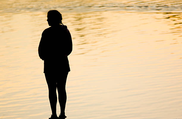 istock silhouette of girl 92802450