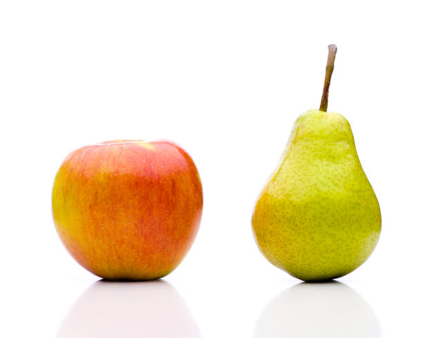 Comparing apples to oranges - the juxtaposition real edible fruits - no artificial ingredients used side by side stock pictures, royalty-free photos & images
