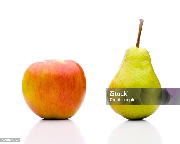Comparing Apples To Oranges The Juxtaposition Stock Photo - Download Image Now - Apple - Fruit, Pear, Comparison