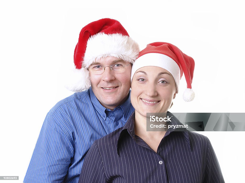 Casal jovem com chapéu de Papai Noel - Foto de stock de Acessório royalty-free