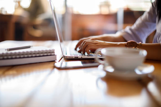 istock Woman working on laptop at a cafe 928028178