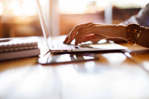 istock Woman typing on laptop at a cafe 928028288