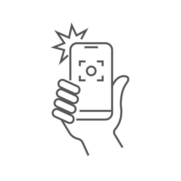 ilustrações de stock, clip art, desenhos animados e ícones de taking selfie on smartphone concept creative icon selfie label. hand holding smartphone linear icon. thin line illustration. smart phone photocamera. editable stroke - photographic camera