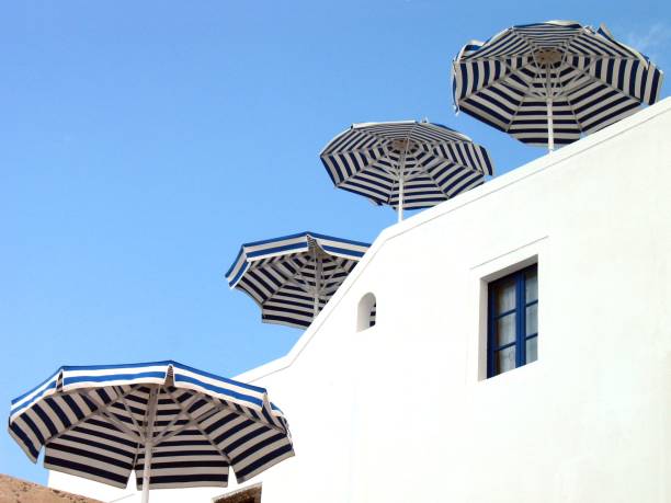 Four Umbrellas with more background stock photo