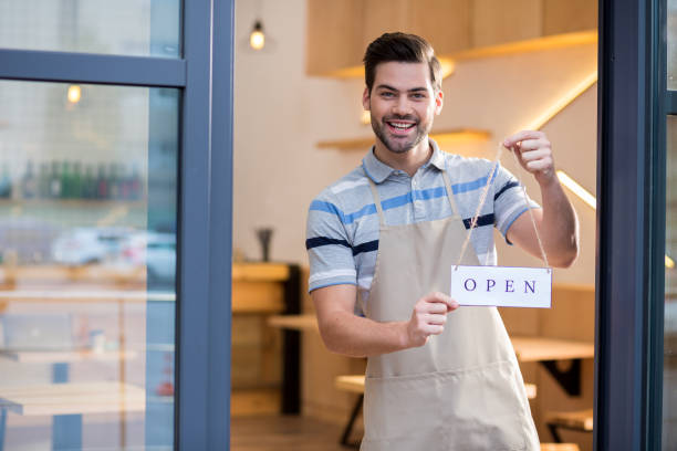 istock Cheerful bearded man standing at the door 928031822