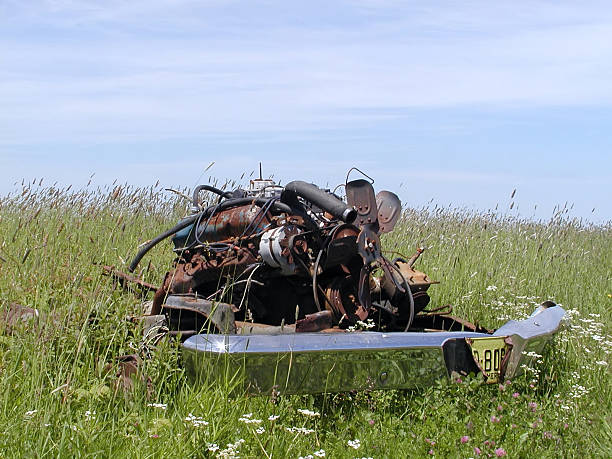 istock Discarded Car Motor In Field Creating An Environmental Eyesore 92803274
