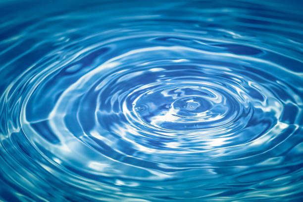 istock Abstract blue circle water drop ripple. Liquid texture with water drop background. 928034950