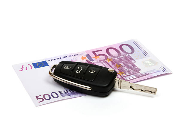 Car key on money background. stock photo