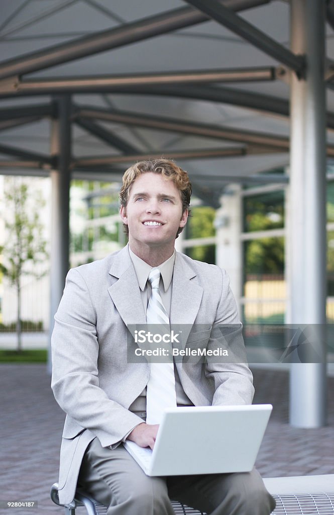 Business man smiling with laptop 2  Achievement Stock Photo