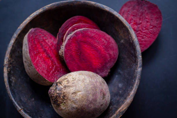 fresh beetroot in rustic wooden bowl still life food  on daylight stock photo