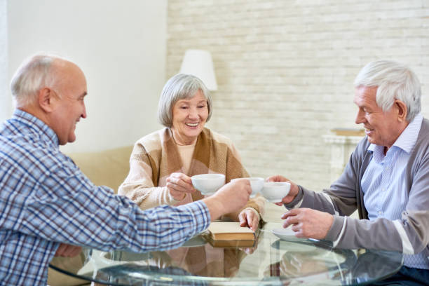 istock Group of Senior Friends Enjoying Tea 928044332