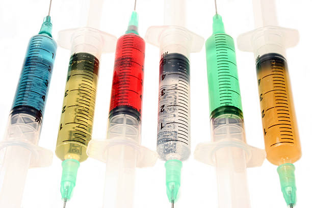 Multicolored syringes stock photo