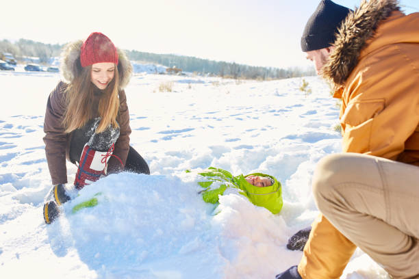istock Parents playing with son in snow 928047188