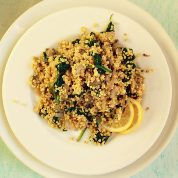 Vegetarian couscous with mushrooms and spinach.