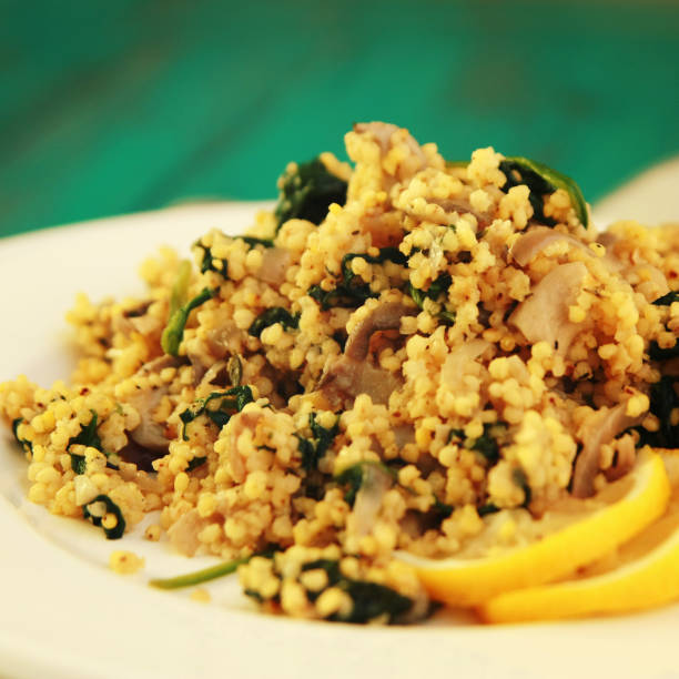 Vegetarian couscous with mushrooms and spinach.