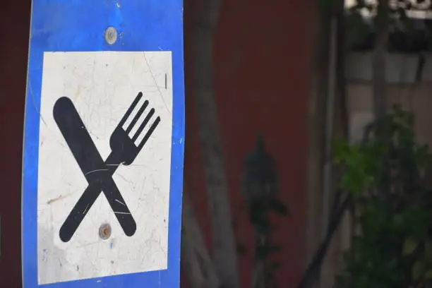 A ROAD sign directed  To A Restaurant
