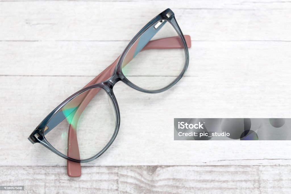 Eye glasses on wooden table Eyeglasses Stock Photo