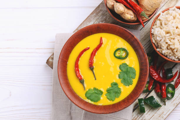 Vegetarian curry Gujarati Kadhi with chickpea and yogurt Traditional Indian cuisine. Vegetarian curry Gujarati Kadhi with chickpea gravy and sour yogurt. Copyspace, top view, flatlay karahi stock pictures, royalty-free photos & images
