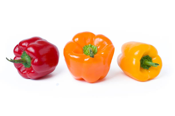 istock Red yellow and orange peppers on a white background. 928065738