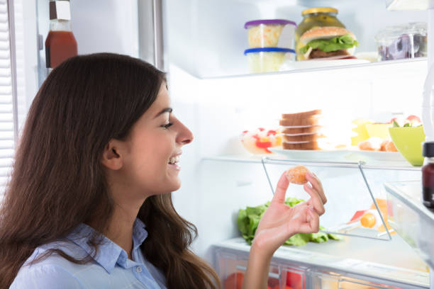 istock Happy Woman Holding Cookie 928066108