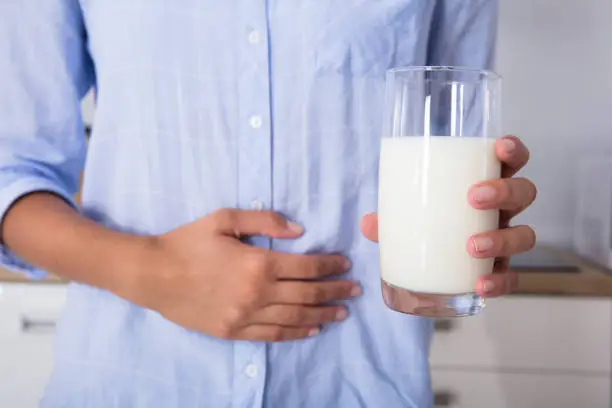 Photo of Mid Section View Of A Woman Holding Glass Of Milk