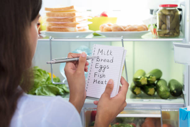 istock Woman Holding Spiral Book With Check List 928068966