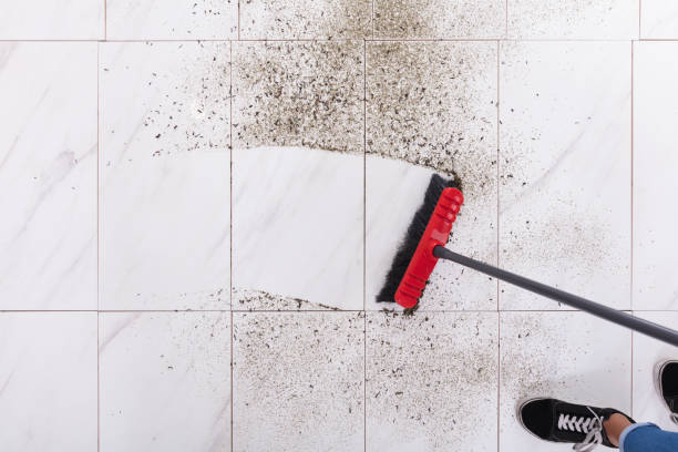 istock Broom Cleaning Dirt On Tiled Floor 928069106