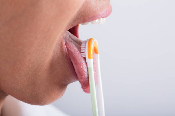 istock Woman Cleaning Tongue 928069592