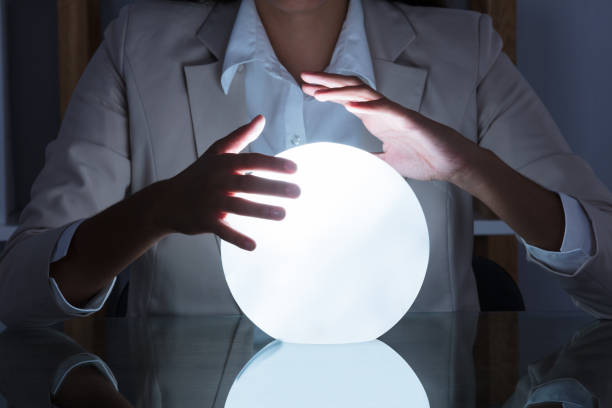 istock Businesswoman Hand On Crystal Ball 928069728