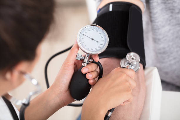 istock Doctor Measures Her Blood Pressure 928070222
