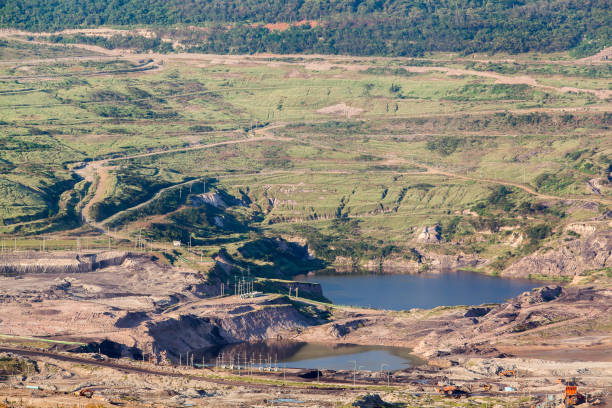 istock Part of a pit with big mining truck working 928070686
