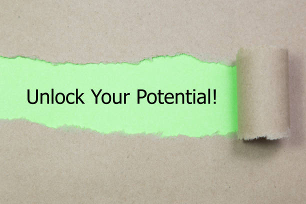 istock The text Unlock Your Potential appearing behind torn paper. 928074480