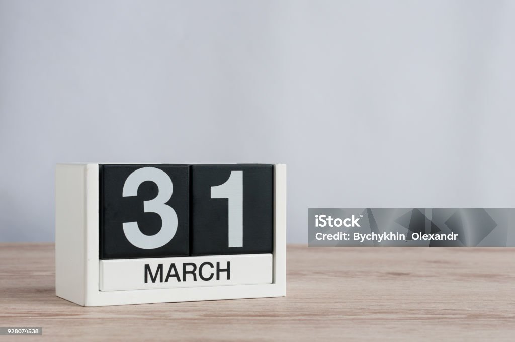 March 31st. Day 31 of month, wooden calendar on light background. Spring time, empty space for text March 31st. Image of march 31 wooden color calendar on white background. Spring day, empty space for text. World Backup Day and the month end. March - Month Stock Photo