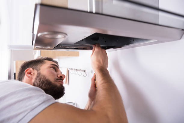istock Electrician Repairing Kitchen Extractor Filter 928076938