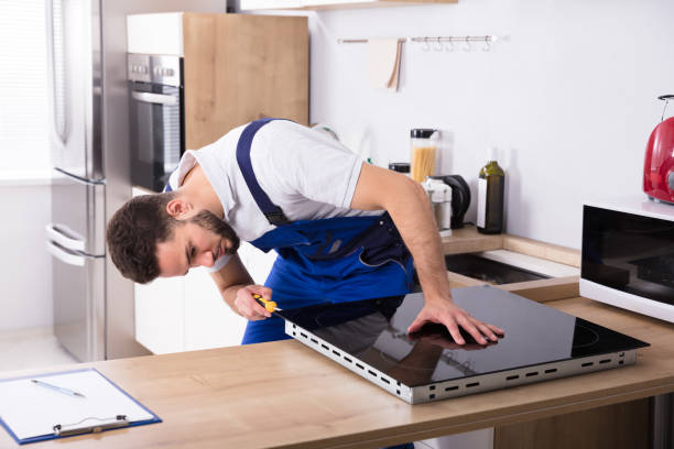 istock Electrician Fixing Induction Stove 928076954