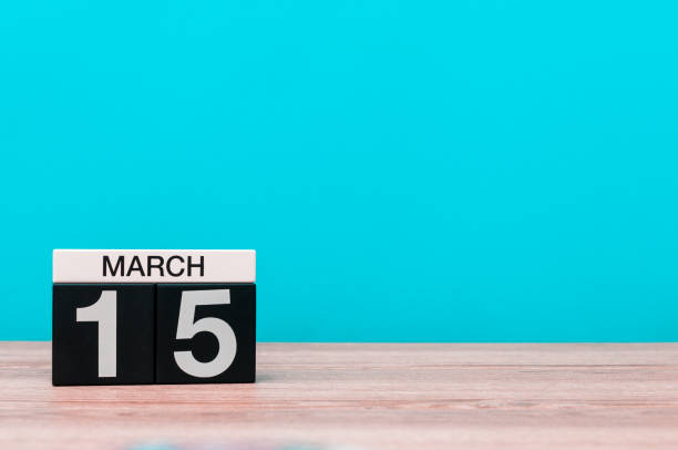 istock March 15th. Day 15 of march month, calendar on turquoise background. Spring time, empty space for text, mockup 928077122