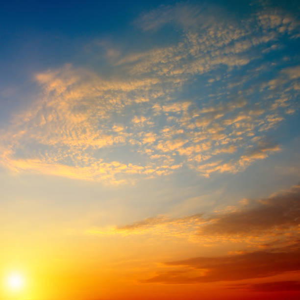 istock Cloudy sky and bright sunrise over the horizon. 928077186