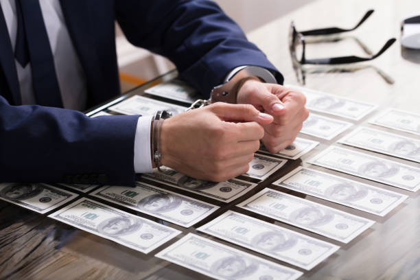 istock Businessperson In Handcuffs Arrested For Bribe 928078216